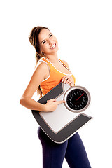 Image showing Athletic girl with a scale