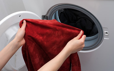 Image showing Loading washing machine