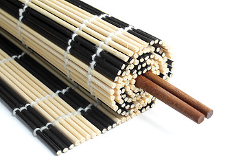 Image showing Rolled bamboo mat with chopsticks