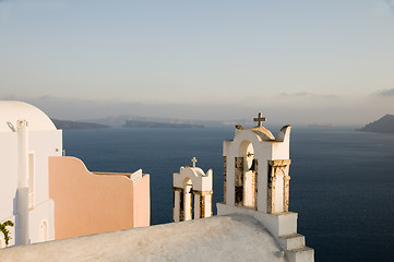 Image showing greek island twin bell tower church over the caldera oia santori