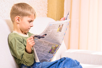Image showing Boy with newspaper