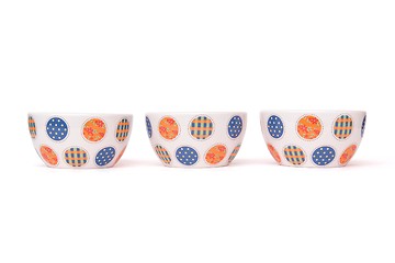 Image showing Row of three porcelain bowls isolated