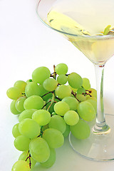 Image showing Very sweet white wine in the martini glasses isolated on white 