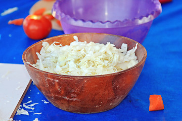 Image showing Tasty kitchen. Wite cabbage in the wooden salad-dish