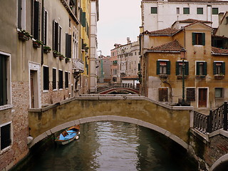 Image showing Venetian bridges across narrow canal