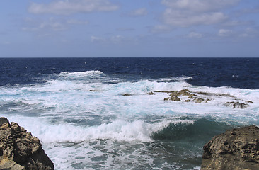 Image showing Stormy waves on rocky beach