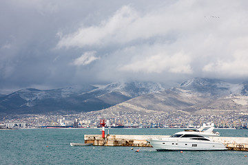 Image showing yacht and boat near the pier with the lighthouse