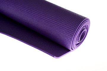 Image showing rolled yoga mat on white