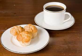 Image showing coffee and muffins on table