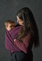 Image showing Mother with her daughter in sling