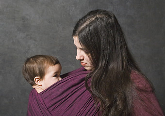 Image showing Mother with her daughter in sling