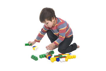 Image showing Boy with multicolored bricks