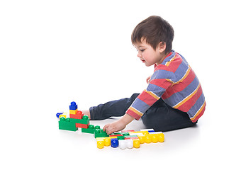 Image showing Boy with multicolored bricks