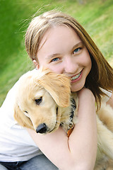 Image showing Girl with puppy