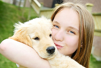 Image showing Girl with puppy