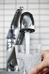 Image showing Filling glass of tap water