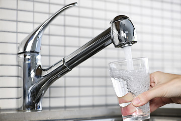 Image showing Filling glass of tap water