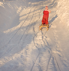 Image showing Child pulling sleigh