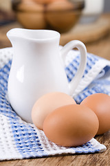 Image showing brown eggs and milk