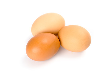 Image showing three brown eggs