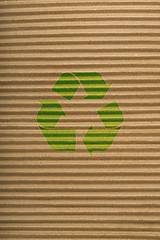 Image showing brown cardboard texture and recycling sign