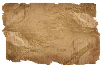 Image showing Piece of brown paper, torn on white