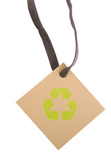 Image showing tan tag and green recycling sign