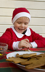 Image showing Decorating gingerbread cookies