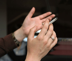 Image showing Conversation with cigarette