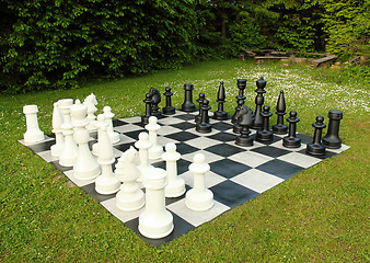 Image showing big outdoor chess in green lawn