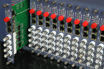 Image showing removable card of fiber optic video converters rack