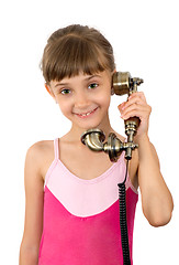 Image showing The girl and ancient phone