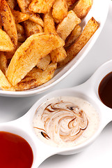 Image showing Homemade chips with dips