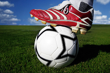 Image showing Soccer ball and shoes