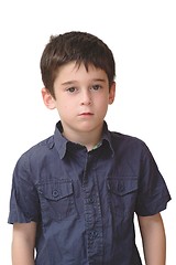 Image showing Serious cute little old boy stands isolated 