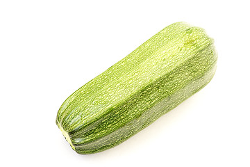 Image showing Single green zucchini isolated on white