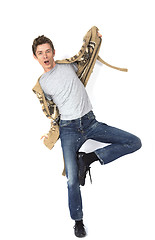 Image showing Young man balancing isolated over a white background 