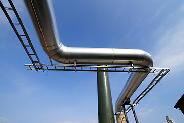 Image showing Industrial zone, Steel pipe-lines on blue sky