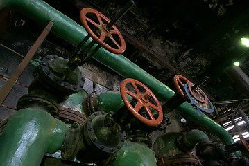 Image showing Pipes, tubes, machinery and steam turbine at a power plant      