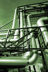 Image showing Industrial zone, Steel pipelines in green tones    