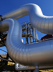 Image showing Industrial zone, Steel pipelines on blue sky