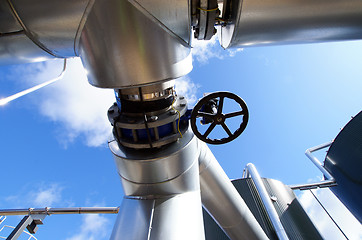 Image showing Industrial zone, Steel pipelines on blue sky