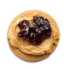 Image showing peanut butter and jelly on biscuit