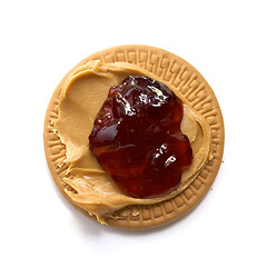 Image showing peanut butter and strawberry jam on biscuit