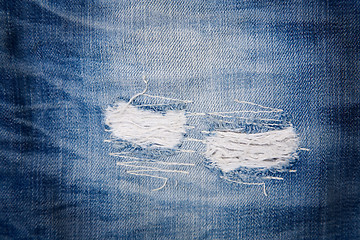 Image showing detail of torn blue denim