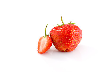 Image showing One whole and one half of tasty ripe red strawberry