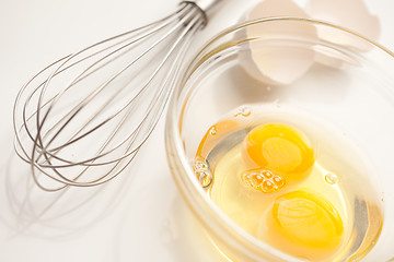 Image showing Hand Mixer with Eggs in Glass Bowl