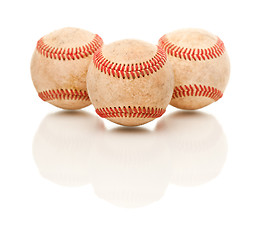 Image showing Three Baseballs Isolated on Reflective White