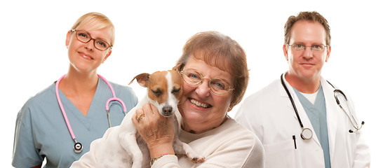 Image showing Happy Senior Woman with Dog and Veterinarian Team