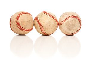 Image showing Three Baseballs Isolated on Reflective White